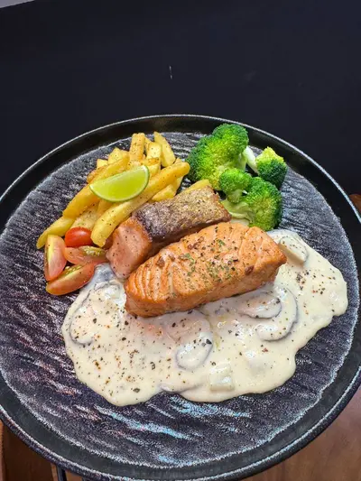GRILLED SALMON STEAK WITH CREAMY MUSROOM SAUCE